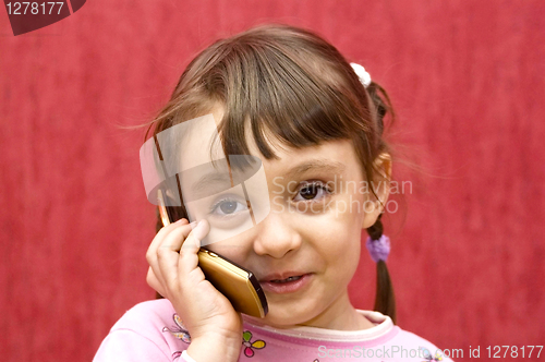 Image of The girl speaks by phone