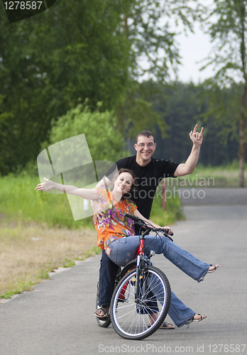 Image of Happy couple at bicycle