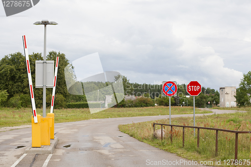 Image of Stop sign and clearway sign near barrier gate