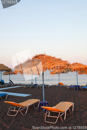 Image of Sunbeds in Perissa, Santorini, Greece