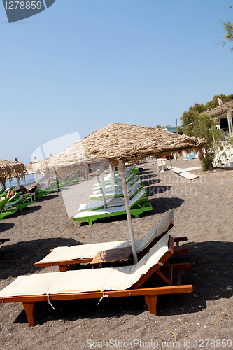 Image of Sunbeds in Perissa, Santorini, Greece