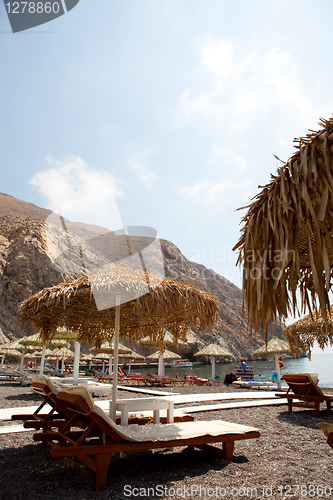 Image of Sunbeds in Perissa, Santorini, Greece