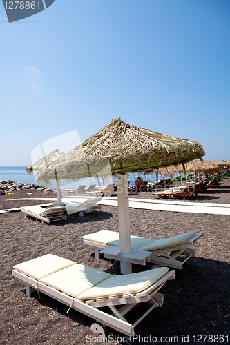 Image of Sunbeds in Perissa, Santorini, Greece