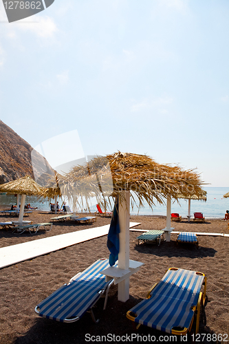 Image of Sunbeds in Perissa, Santorini, Greece