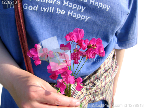 Image of woman's hand with flower 
