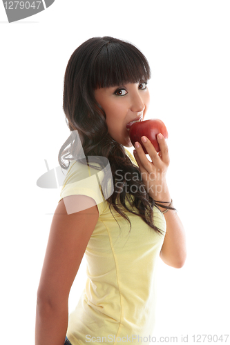 Image of Girl biting into a red apple