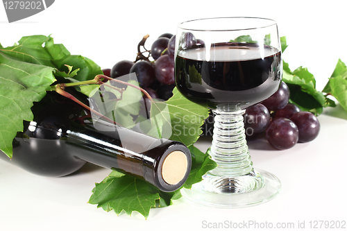 Image of red wine with glass