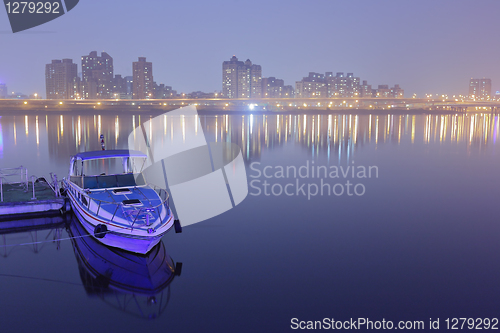 Image of Taipei pier with city at night