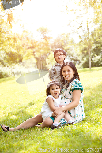 Image of Pregnant Asian mother and her kids