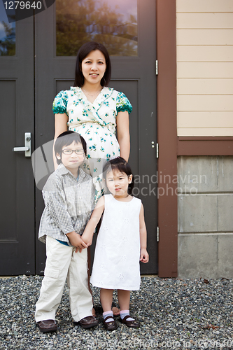 Image of Pregnant Asian mother and her kids