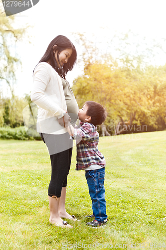 Image of Pregnant Asian mother and her son