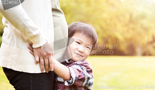 Image of Pregnant Asian mother and her son