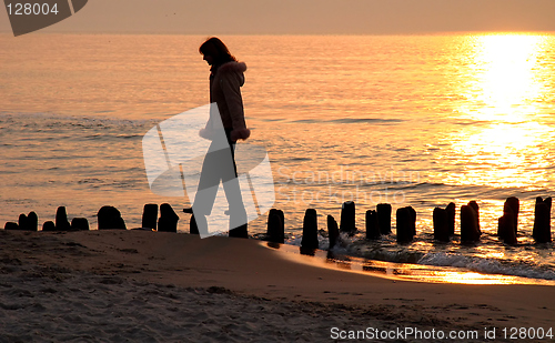 Image of walk at the sea during a sunset