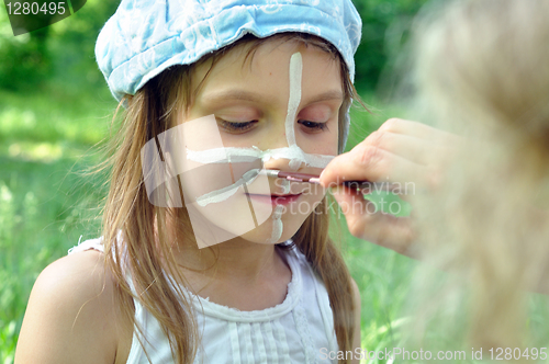 Image of painting a face mask