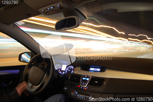 Image of car in motion at night