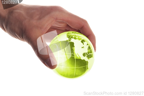 Image of hand holding globe