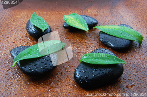Image of zen concept with stones and leaves