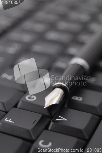 Image of pen and keyboard