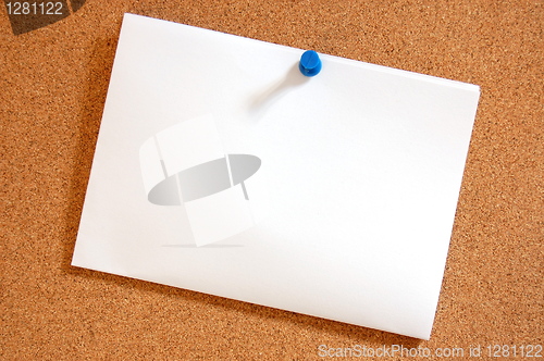 Image of blank sheet of paper on bulletin board