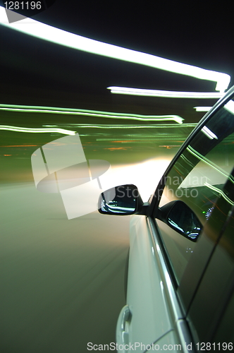 Image of night drive with car in motion 
