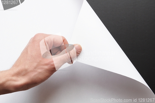 Image of paper and hand