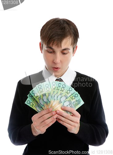 Image of Student or young worker looking down at handful of cash