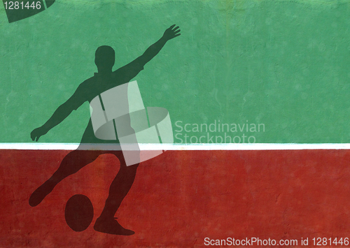 Image of Not Quite Tennis - Rugby Player Silhouette Against Practice Wall