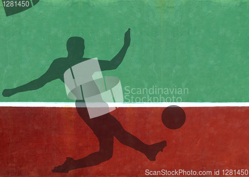 Image of Not Quite Tennis - Soccer Player Silhouette Against Practice Wal