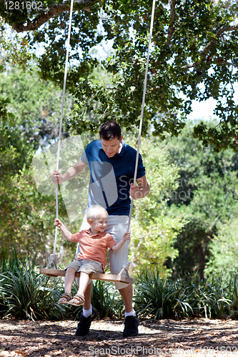 Image of father and son on a swing