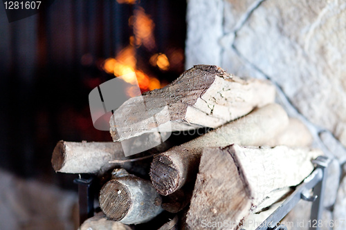 Image of firewood and fireplace