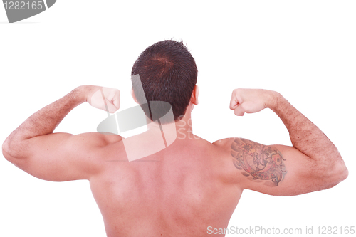 Image of Young sexy man showing his biceps isolated on white