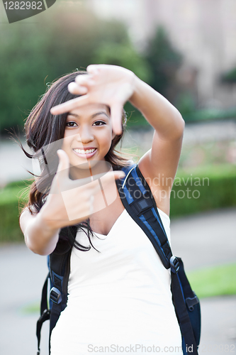 Image of Asian college student making a frame