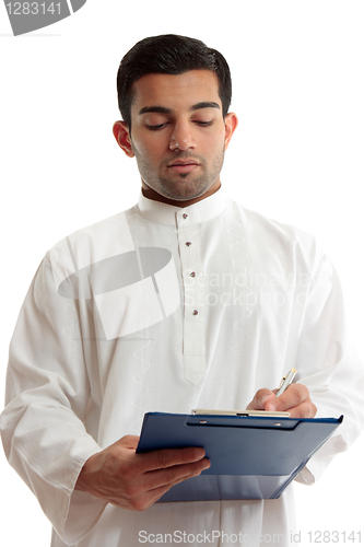 Image of Ethnic business man writing 