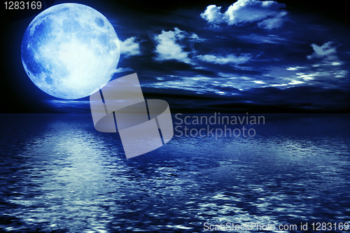 Image of Full moon reflected in water