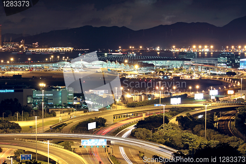 Image of Freeway in night with cars light in modern city. 