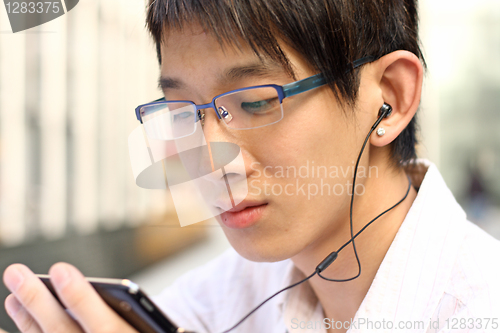 Image of Businessman Using a Hands Free Device 