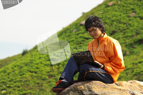 Image of asain Man with notebook 