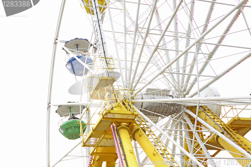 Image of ferris wheel against a blue sky