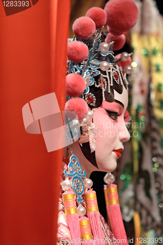 Image of chinese opera dummy and red cloth as text space ,it is a toy,not