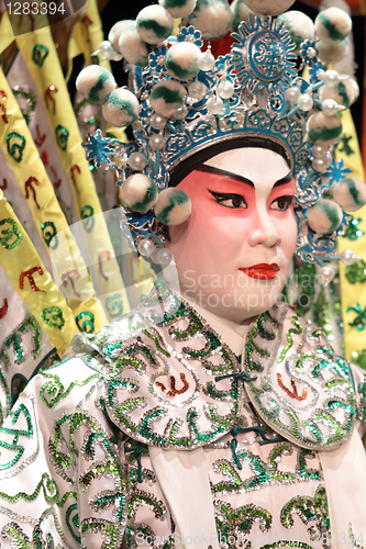 Image of chinese opera dummy and red cloth as text space ,it is a toy,not