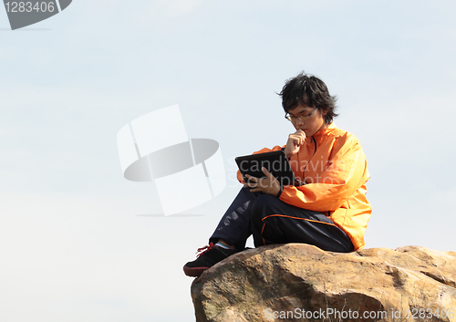 Image of asain Man with notebook 