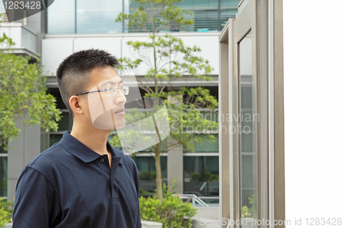 Image of man seeing the advertising board