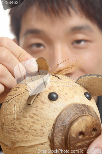 Image of asia man with piggy bank 