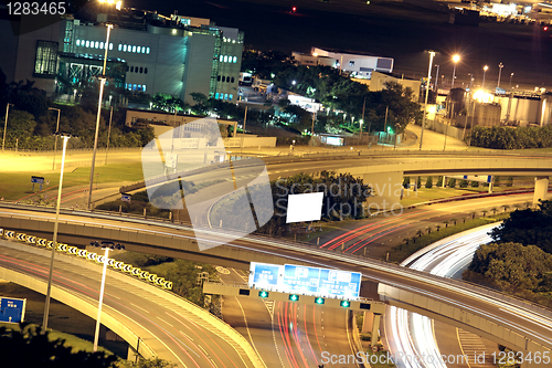 Image of Freeway in night with cars light in modern city. 