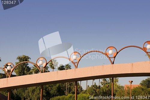 Image of Unique Brass Lighting along the Bridge