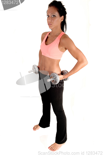 Image of Girl lifting dumbbells.