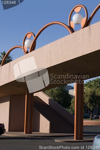 Image of Unique Brass Lighting along the Bridge