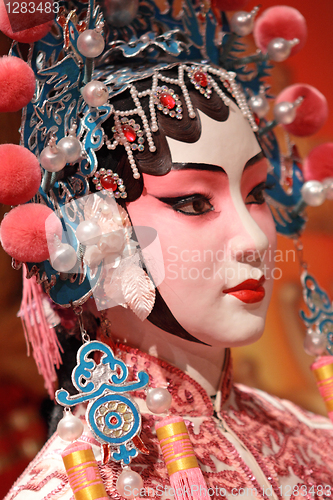 Image of chinese opera dummy and red cloth as text space ,it is a toy,not