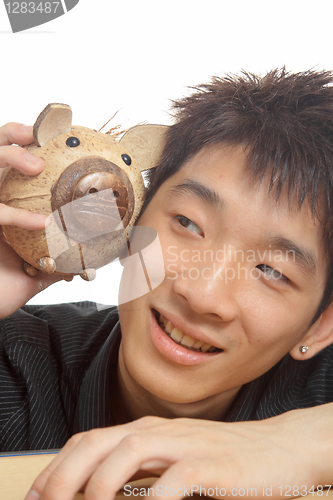 Image of asia man with piggy bank 