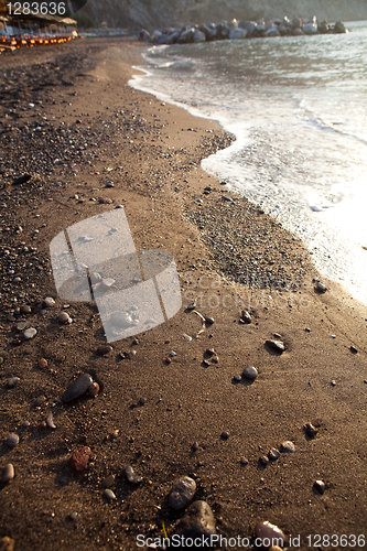 Image of Sand. Perissa beach, Santorini, Greece